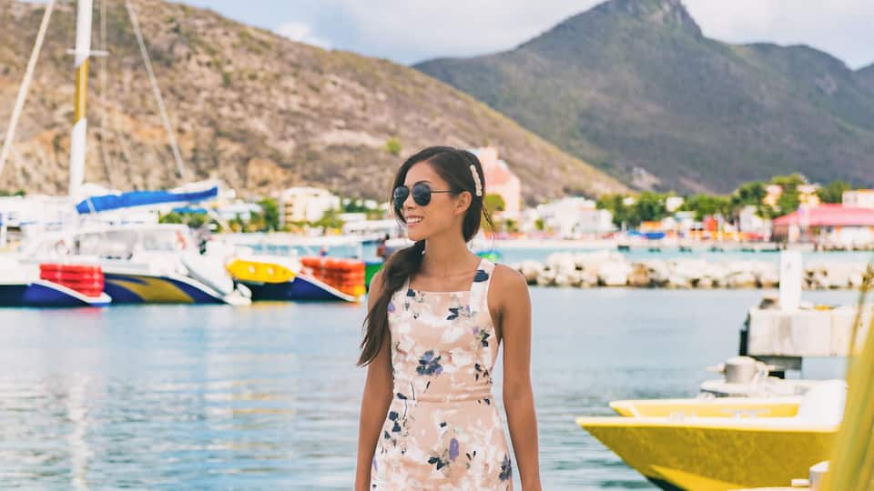 Caribbean cruise travel woman touristin Philipsburg, St Maarten, holiday banner landscape panorama. Cruise ship travel destination. Netherlands Antilles.