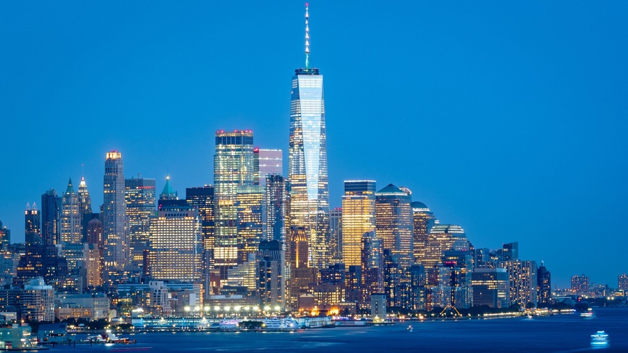 Financial District which includes a bay or harbor, a city and night scenes