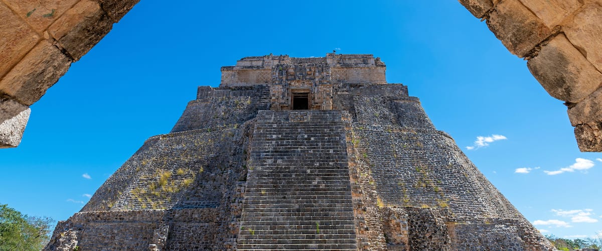 A pyramid structure with a clear blue sky in the background.