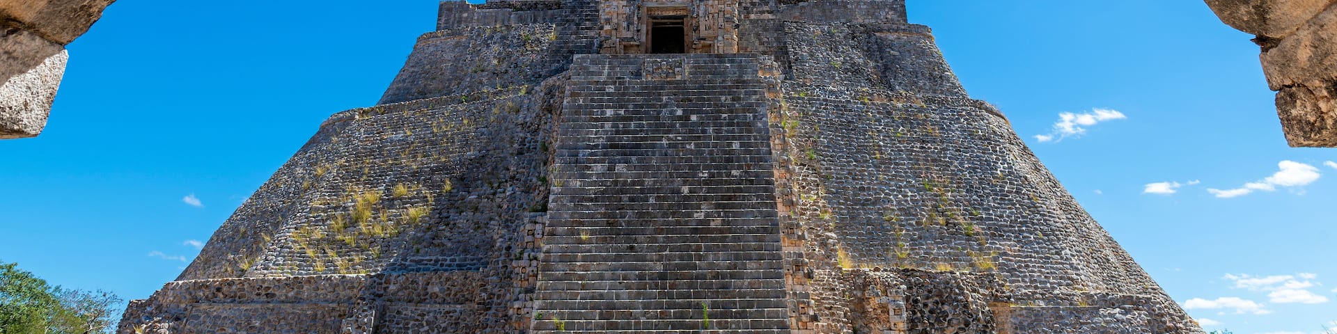 A pyramid structure with a clear blue sky in the background.