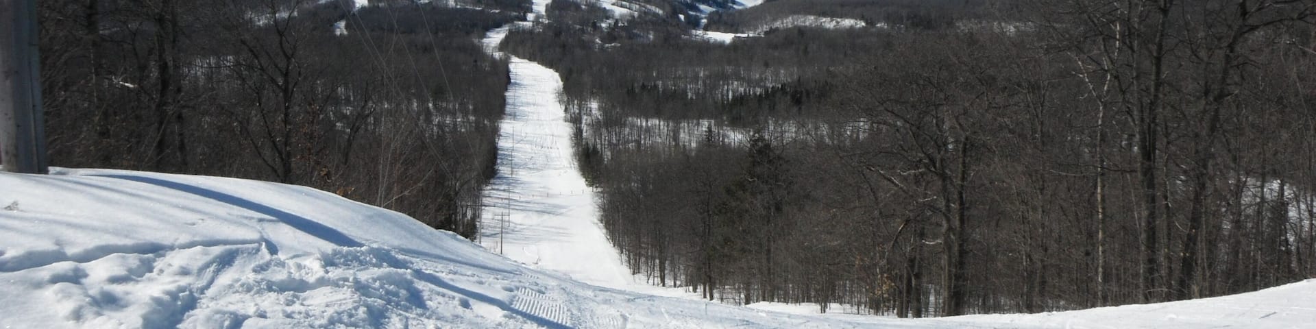 Skiing at Indianhead Mountain, MI looking towards Blackjack. Lots of snow...and you can ski both places.