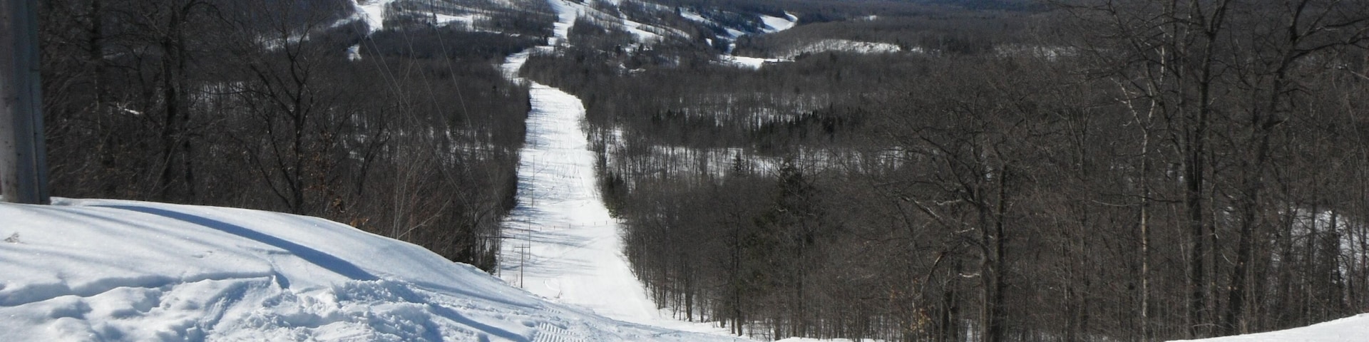 Skiing at Indianhead Mountain, MI looking towards Blackjack.  Lots of snow...and you can ski both places.