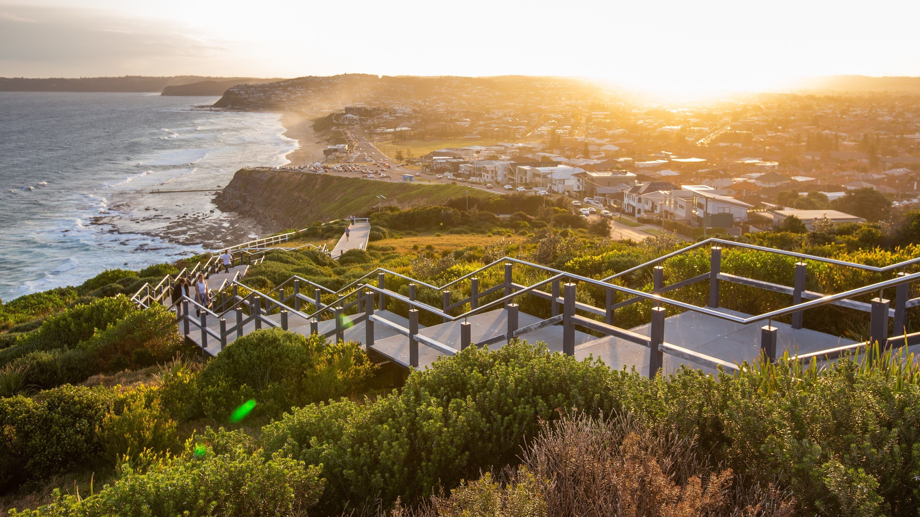 ANZAC Memorial Bridge which includes a sunset, general coastal views and landscape views