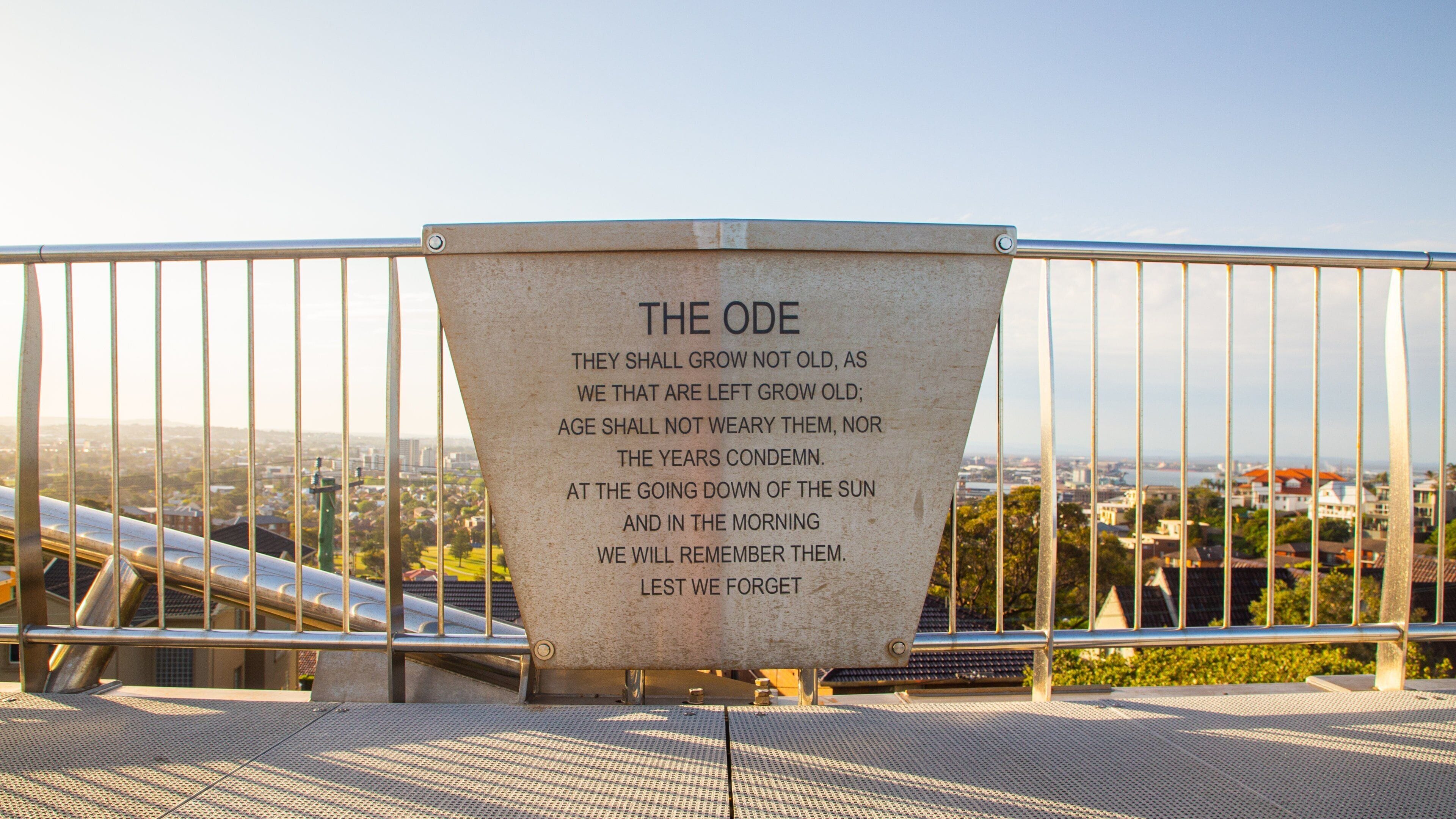 ANZAC Memorial Bridge showing a sunset and signage