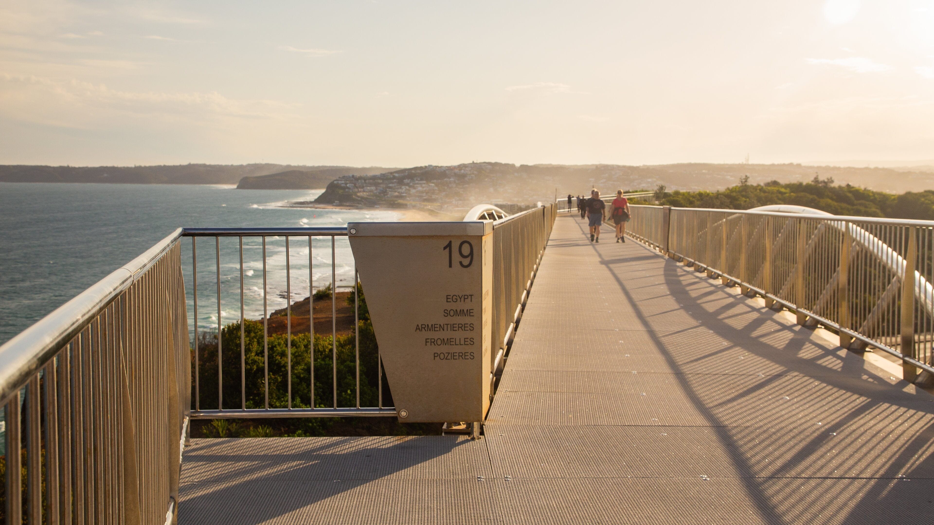 ANZAC Memorial Bridge featuring general coastal views and a sunset