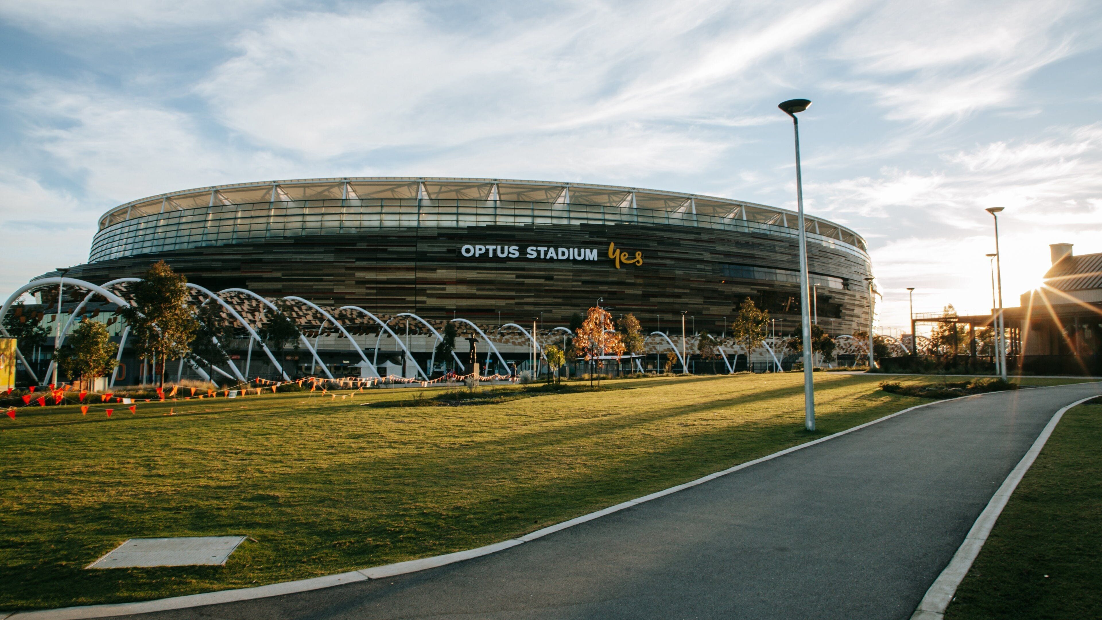 Optus Stadium featuring a sunset