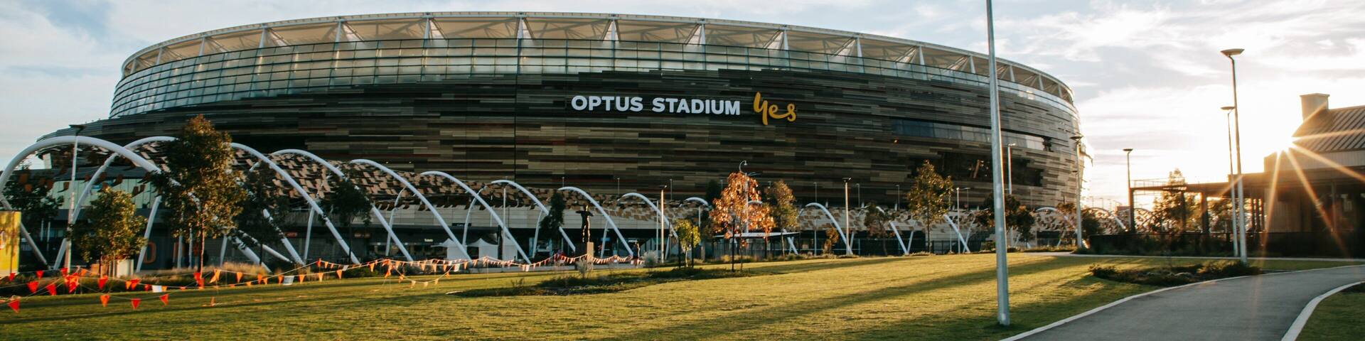 Optus Stadium featuring a sunset
