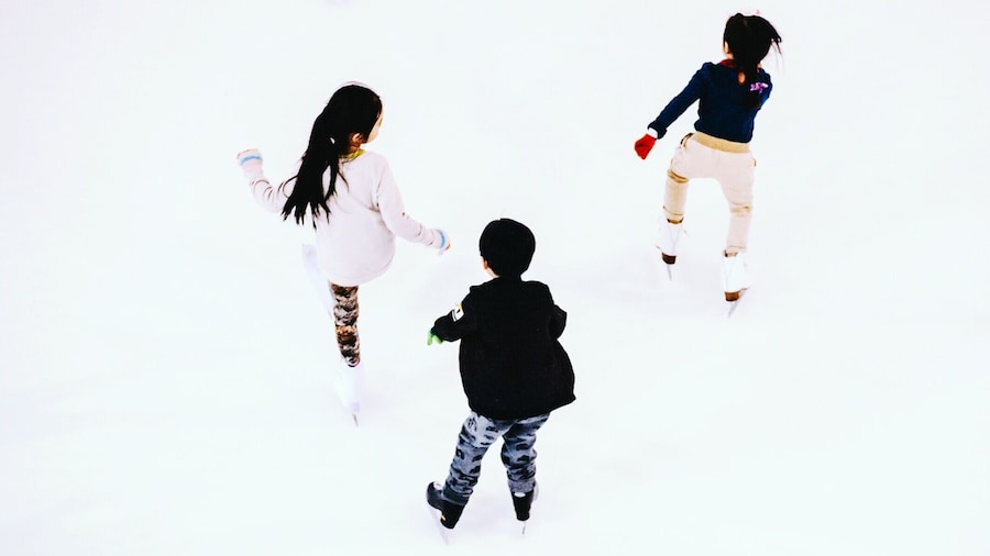 Rear View Of Children Ice-Skating At Sunway Pyramid