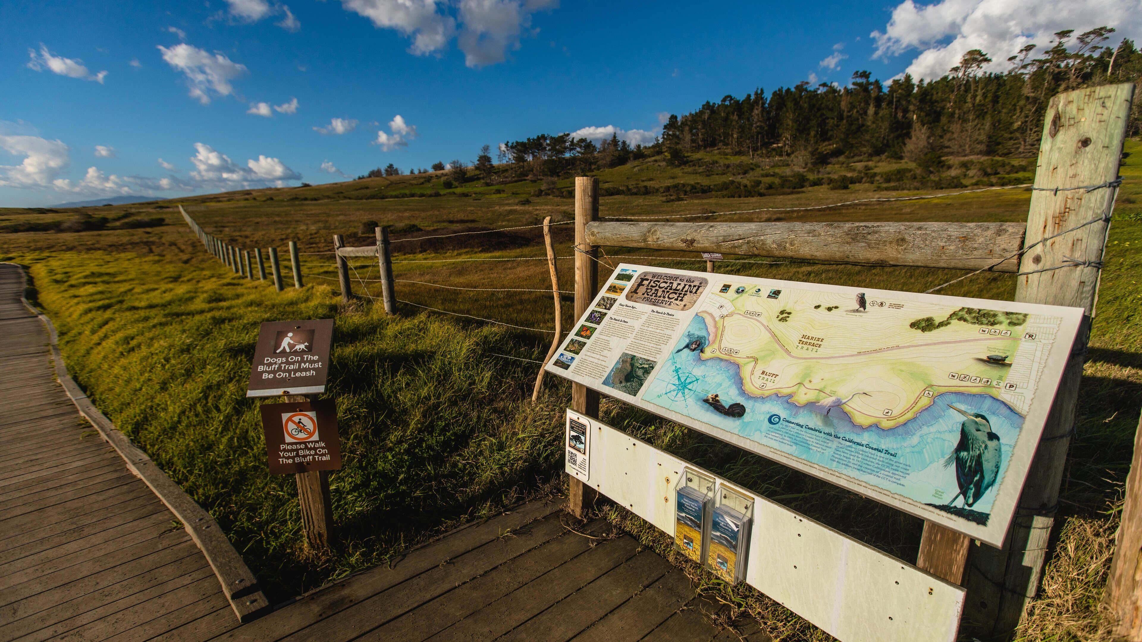 Fiscalini Ranch Preserve featuring signage and tranquil scenes
