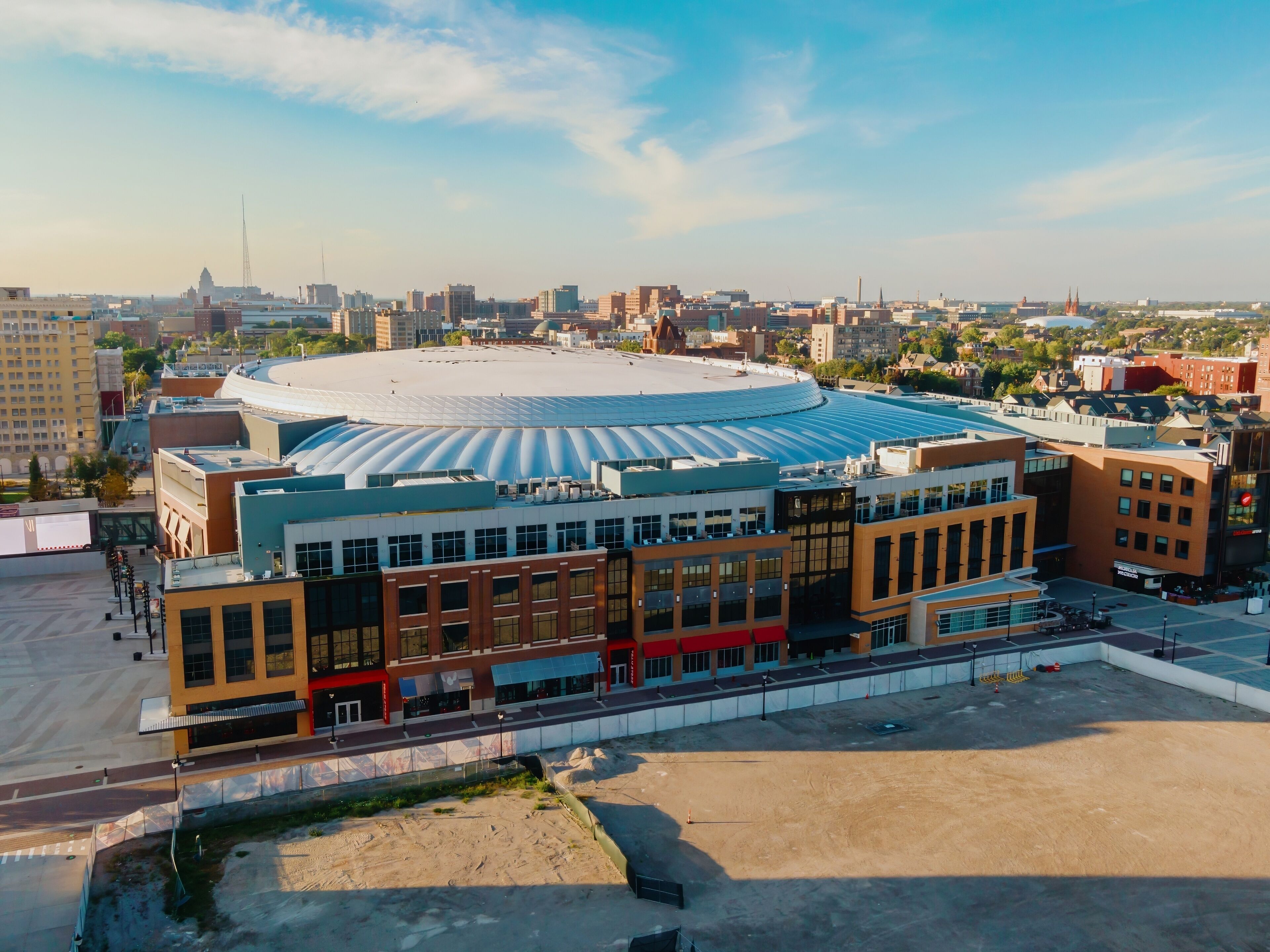 Aerial view of Little Caesars Arena, Detroit, with surrounding city buildings. Construction site visible. LITTLE CAESARS ARENA, DETROIT, MICHIGAN, UNITED STATES