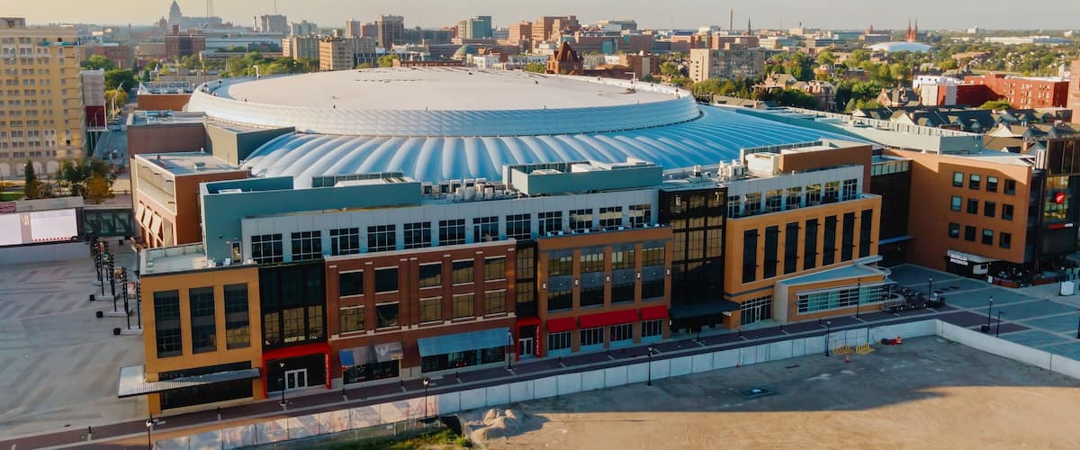 Aerial view of Little Caesars Arena, Detroit, with surrounding city buildings. Construction site visible. LITTLE CAESARS ARENA, DETROIT, MICHIGAN, UNITED STATES