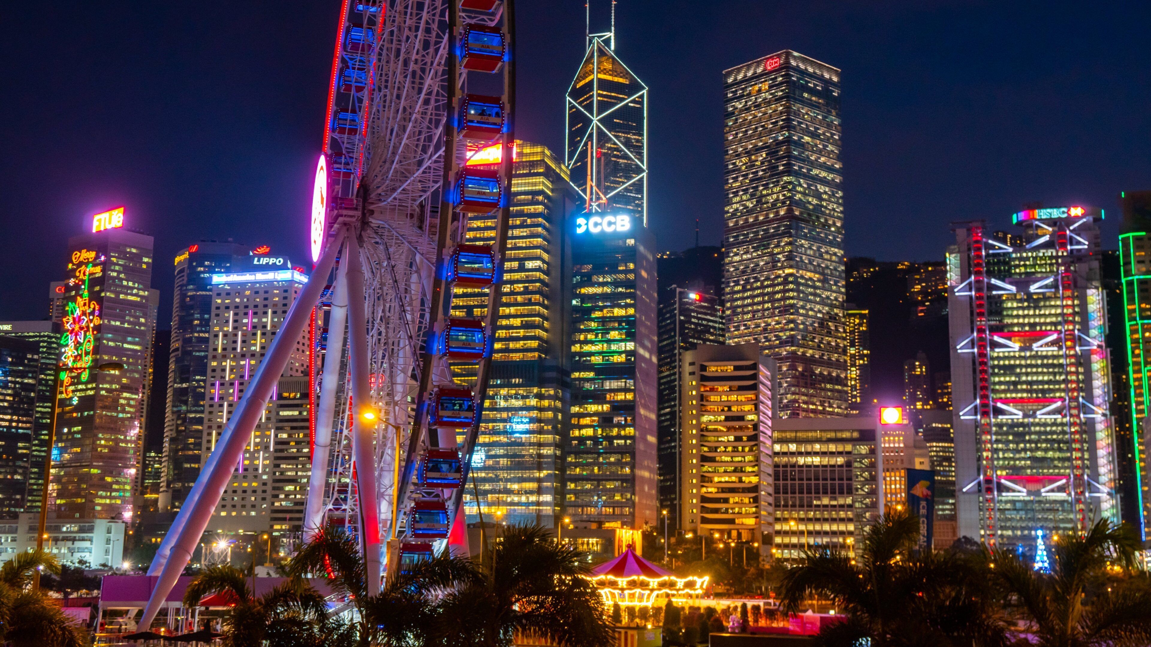 The Hong Kong Observation Wheel featuring a city and night scenes