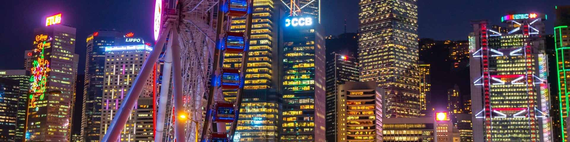 The Hong Kong Observation Wheel featuring a city and night scenes