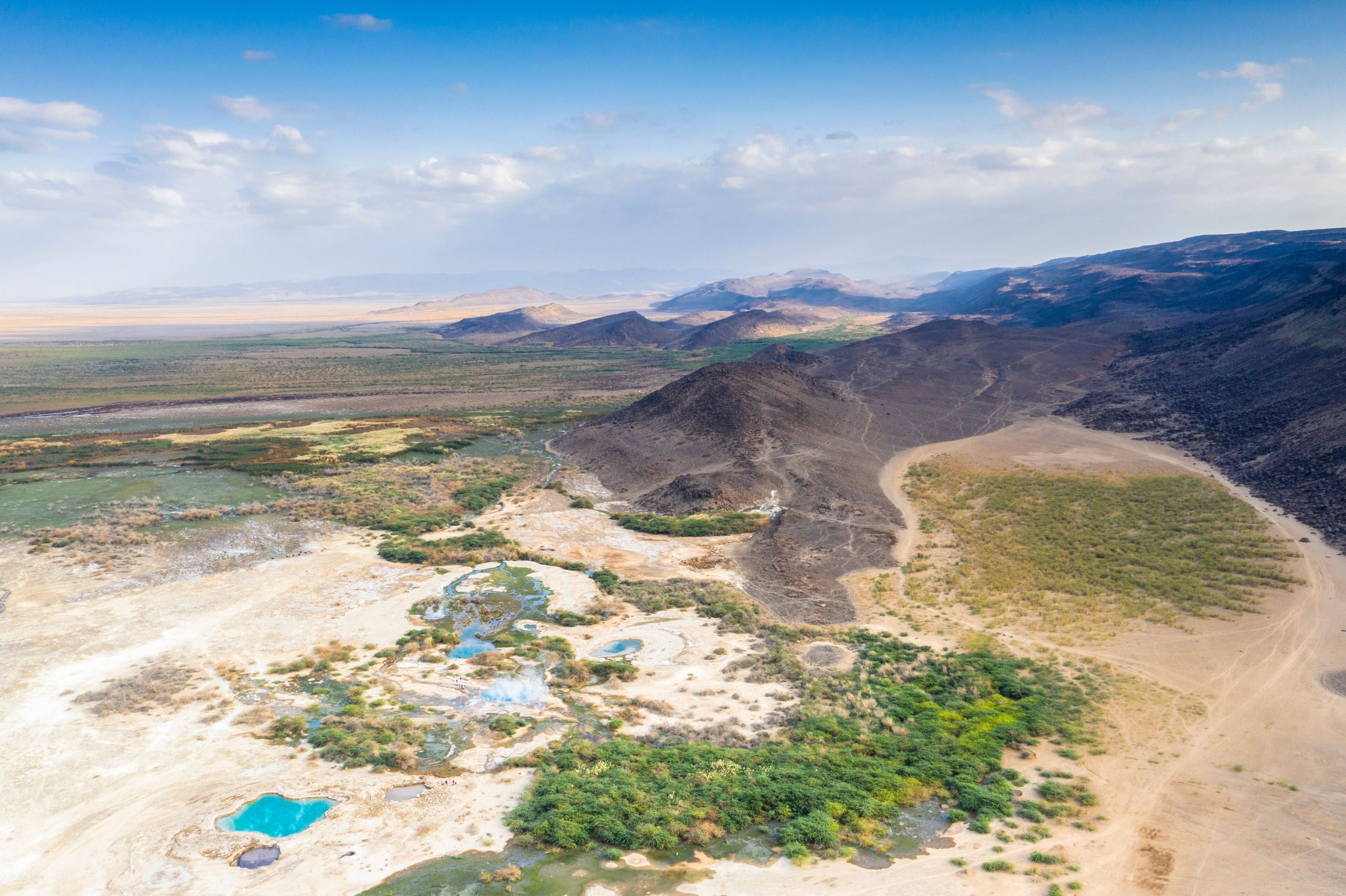Aerial view by drone of Ala Lobet (Alol Bet) geyser and volcanic landscape, Semera, Afar Region, Ethiopia