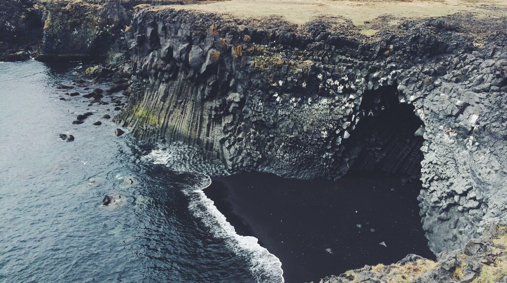 Black sand beaches and cliffs at Arnarstapi.