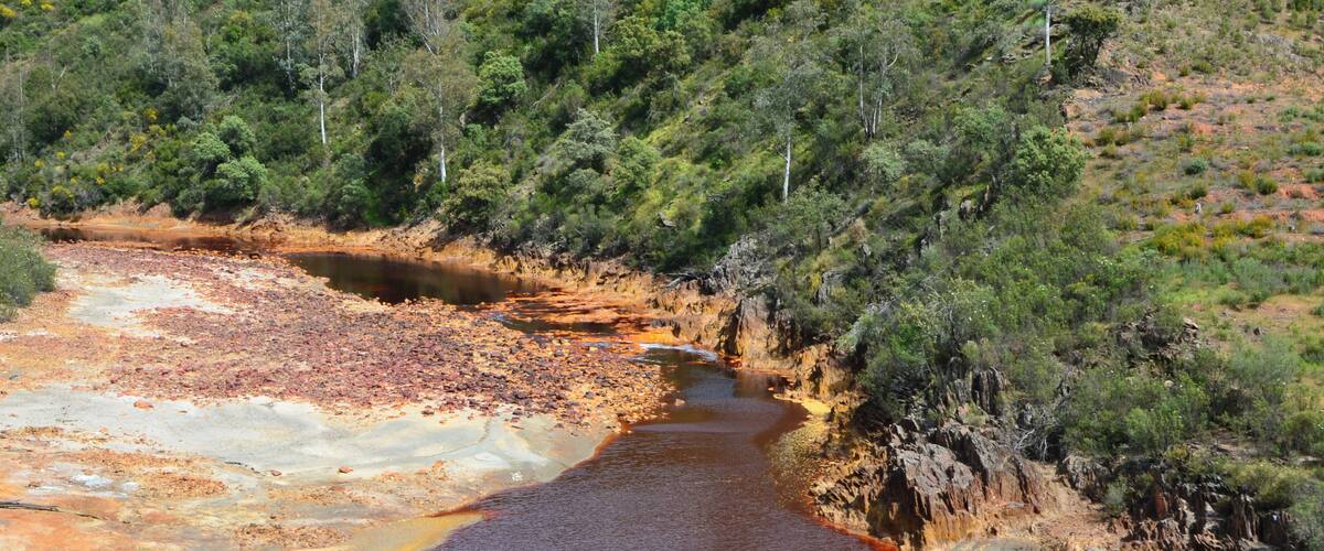 The Río Tinto (« red river »), spanish river of Andalusia (Spain) photographied from the touristic train of the Parque Minero de Riotinto, between Nerva and Berrocal (province of Huelva).