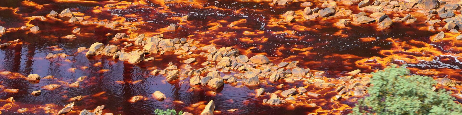 The Río Tinto (« red river »), spanish river of Andalusia (Spain) photographied from the touristic train of the Parque Minero de Riotinto, between Nerva and Berrocal (province of Huelva).