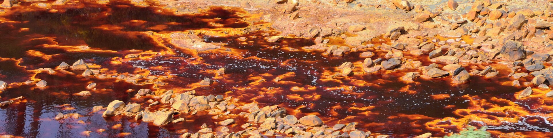 The Río Tinto (« red river »), spanish river of Andalusia (Spain) photographied from the touristic train of the Parque Minero de Riotinto, between Nerva and Berrocal (province of Huelva).