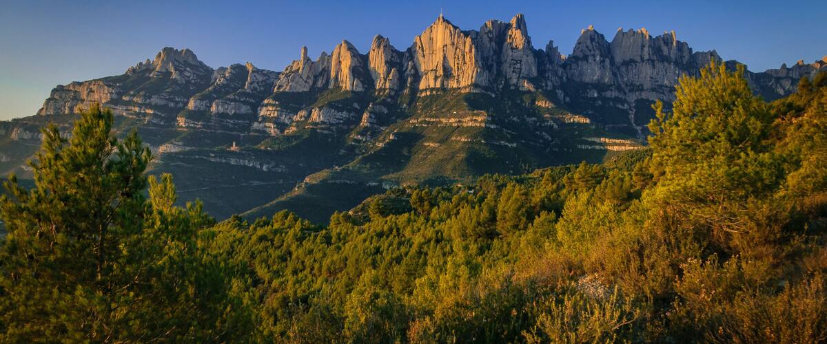 Montserrat mountain in a winter sunrise, seen from the north face, in Marganell (Barcelona province, Catalonia, Spain)