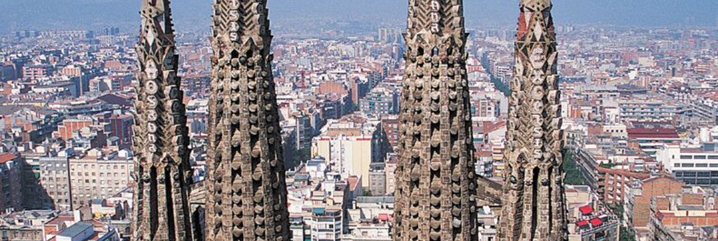Close Up of the Spires of La Sagrada Familia With a Cityscape of Barcelona in the Background, Spain