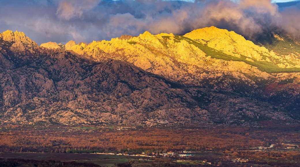A mountain range with a valley below.