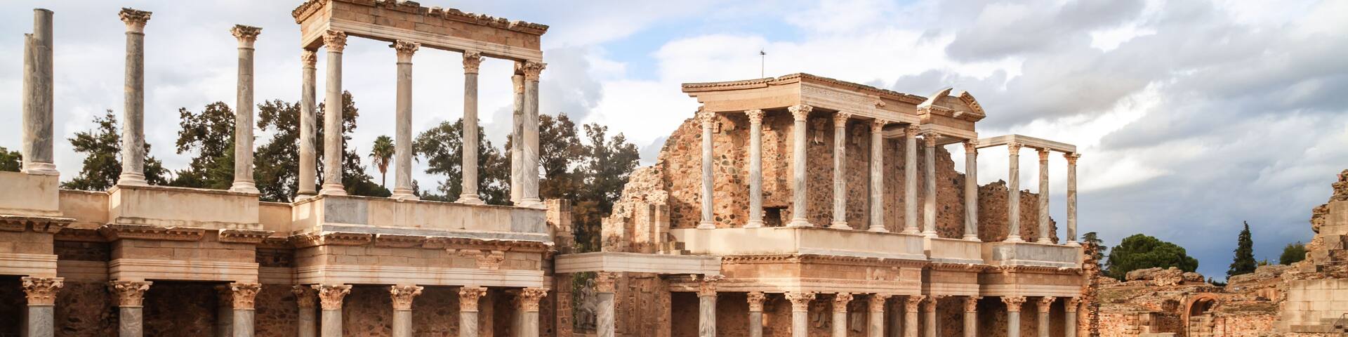 Ancient ruins with columns and a theater.