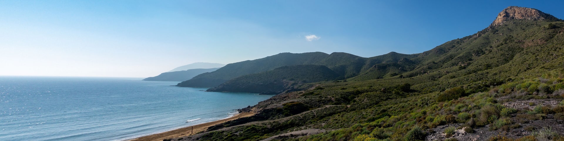 Green mountains and sandy beaches of regional park of Calblanque, Monte de las Cenizas and Peña del Aguila in Spain