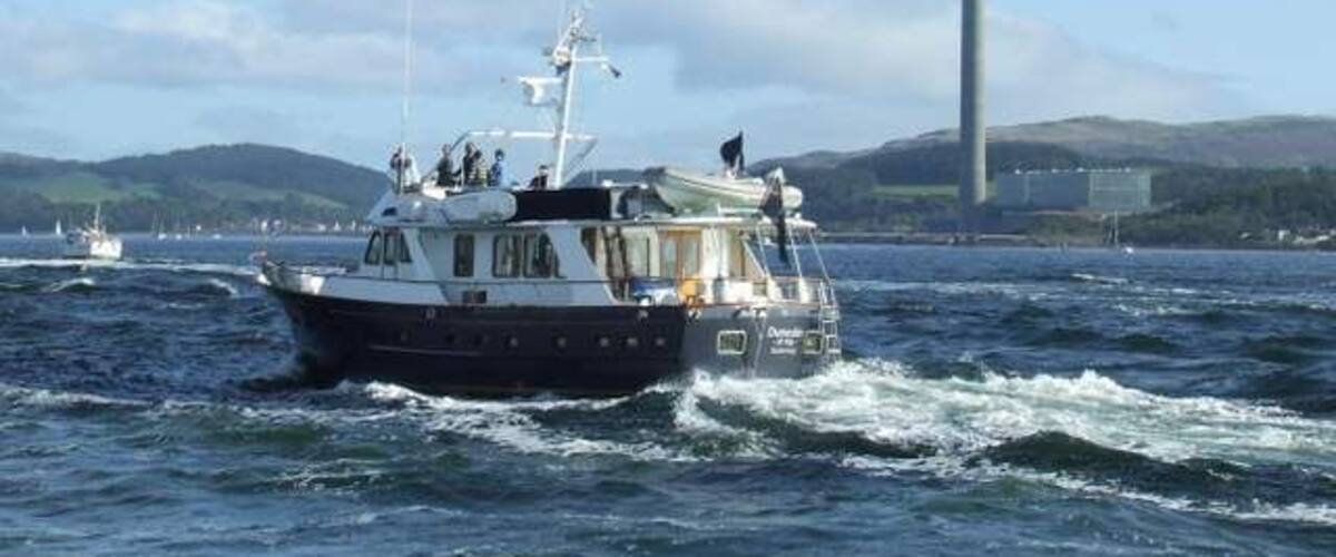 Inverkip Power Station Viewed from MV Saturn as the QE2 sailed up the Clyde for the last time. The boat in the foreground is the Guernsey registered "Dunedin of Kip".