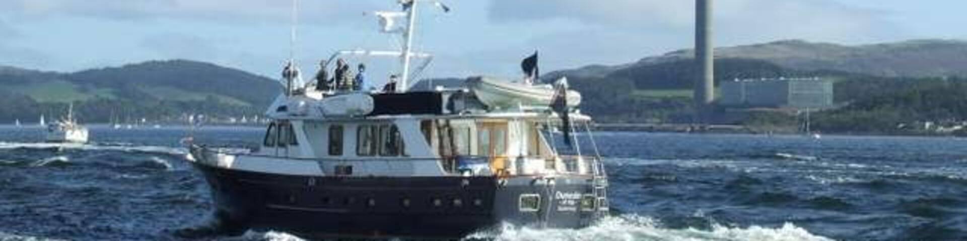Inverkip Power Station Viewed from MV Saturn as the QE2 sailed up the Clyde for the last time. The boat in the foreground is the Guernsey registered "Dunedin of Kip".
