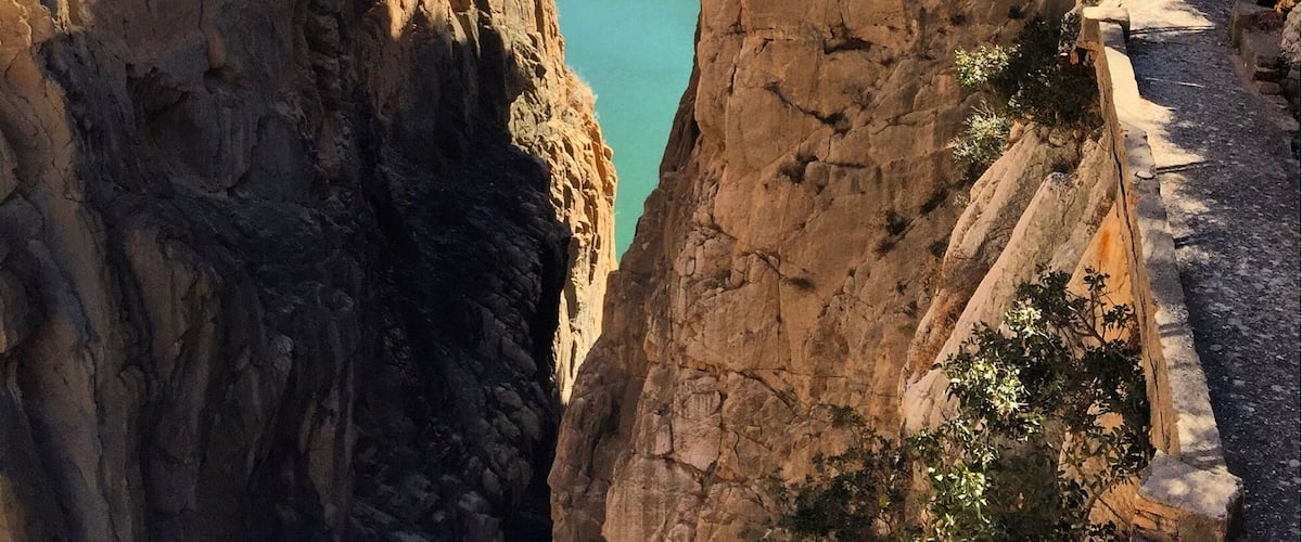 El Caminito del Rey is a very beautiful walkway, pinned along the steep walls of a narrow gorge in El Chorro, Spain.
If you are visiting Malaga, it is easily accessible with a renfe train which takes about 40 minutes.
