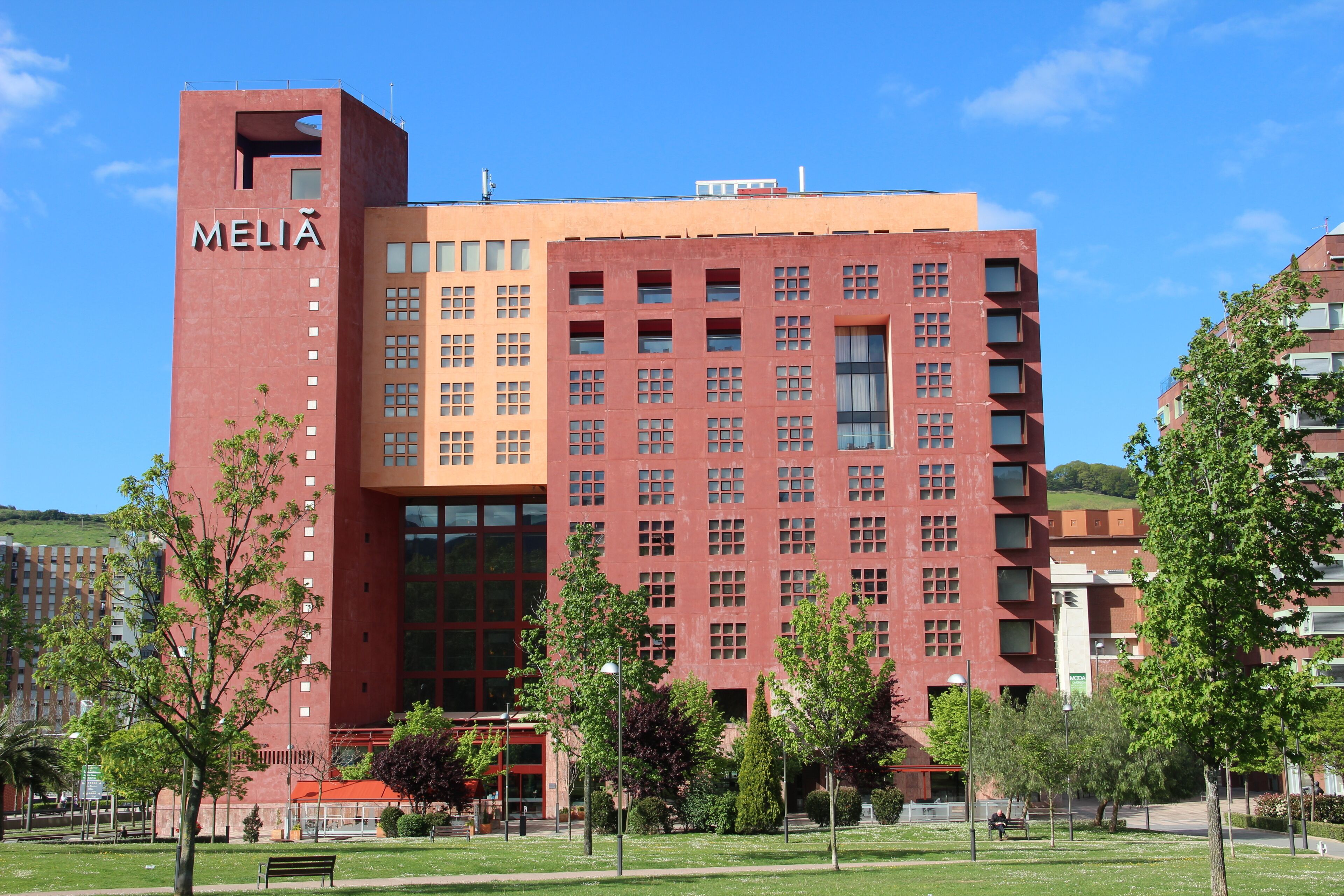 A red and orange building with the name "MELIA" on it.