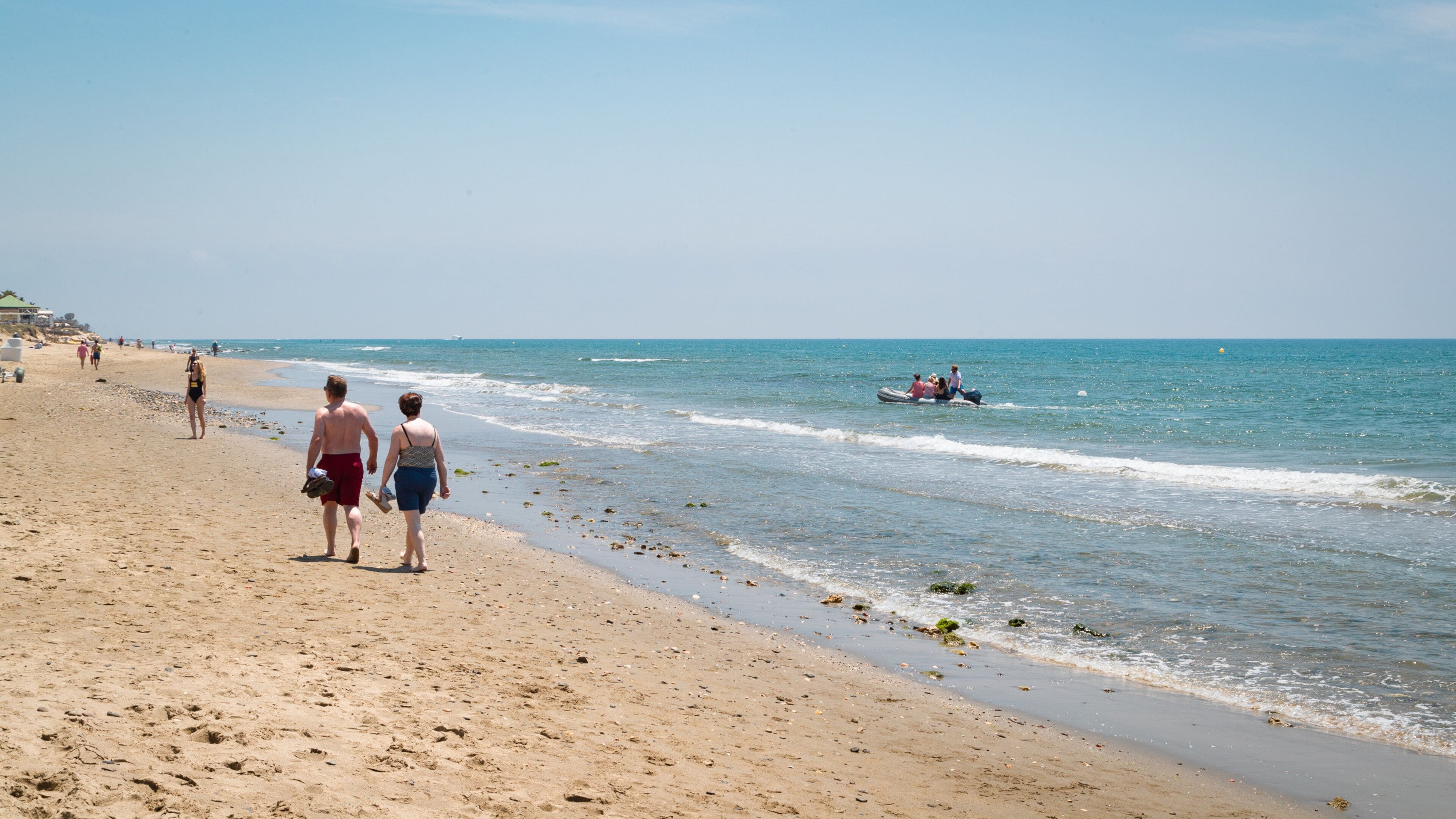 Nikki Beach showing general coastal views and a sandy beach as well as a couple