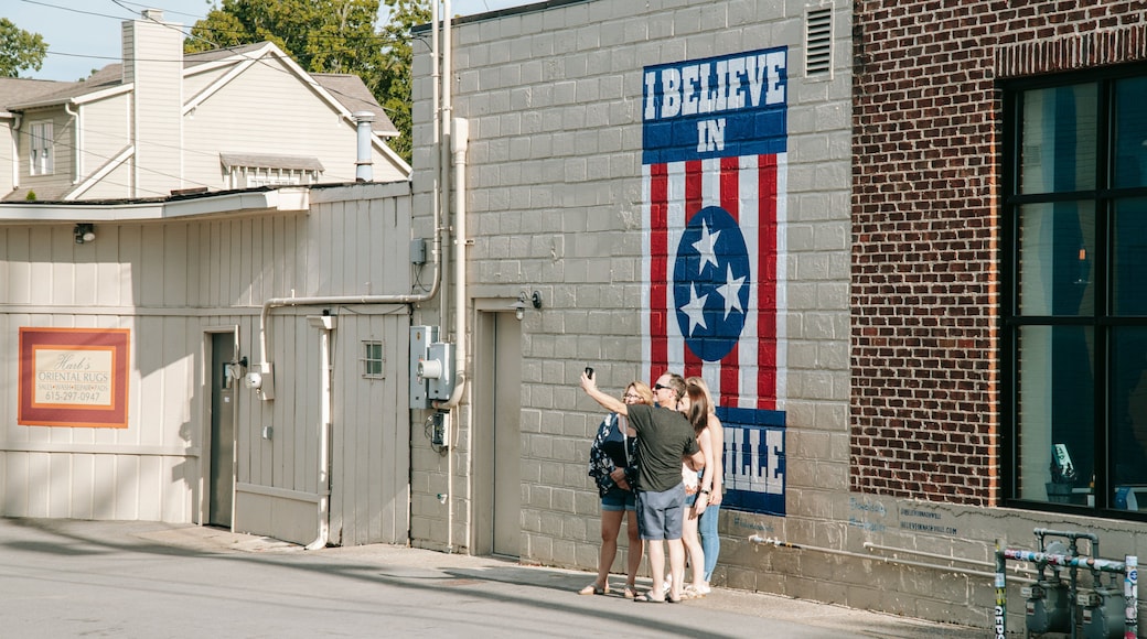 12 South which includes outdoor art and street scenes as well as a small group of people