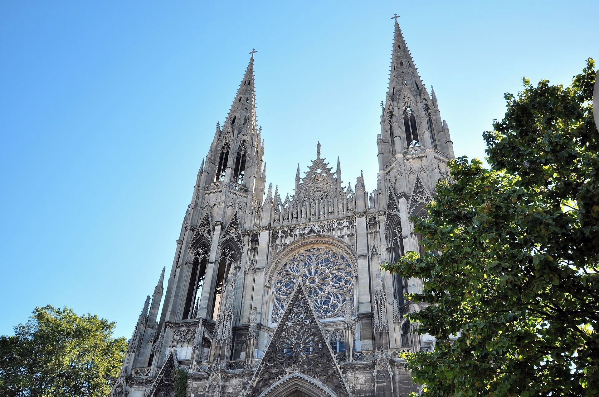 A Gothic cathedral with intricate spires and a large rose window.