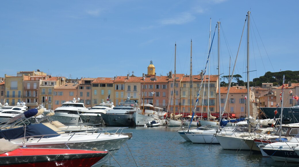 Old city center of Saint-Tropez with harbour and tall ships