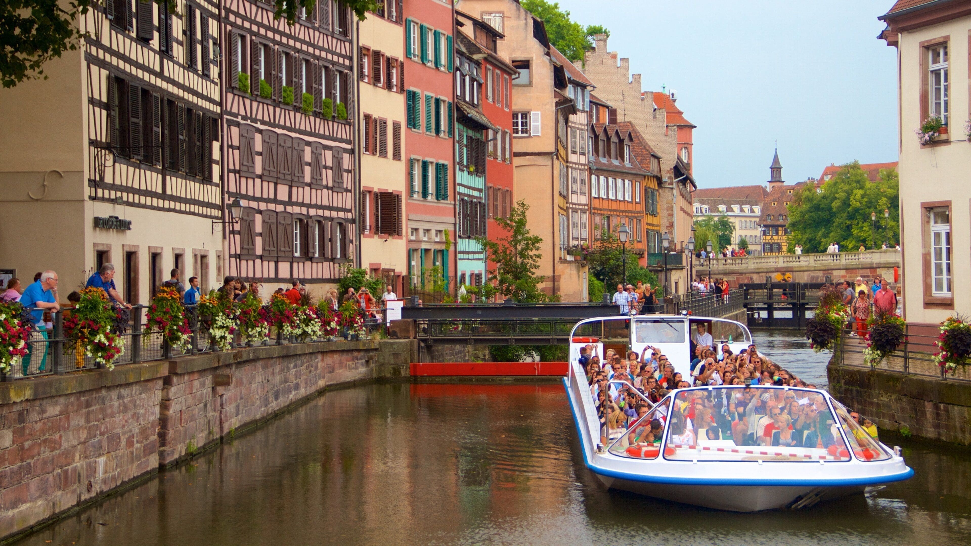 Petite France featuring boating, a city and a river or creek