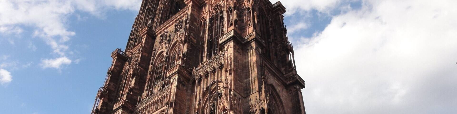 A Gothic cathedral with intricate stone carvings and a tall spire.