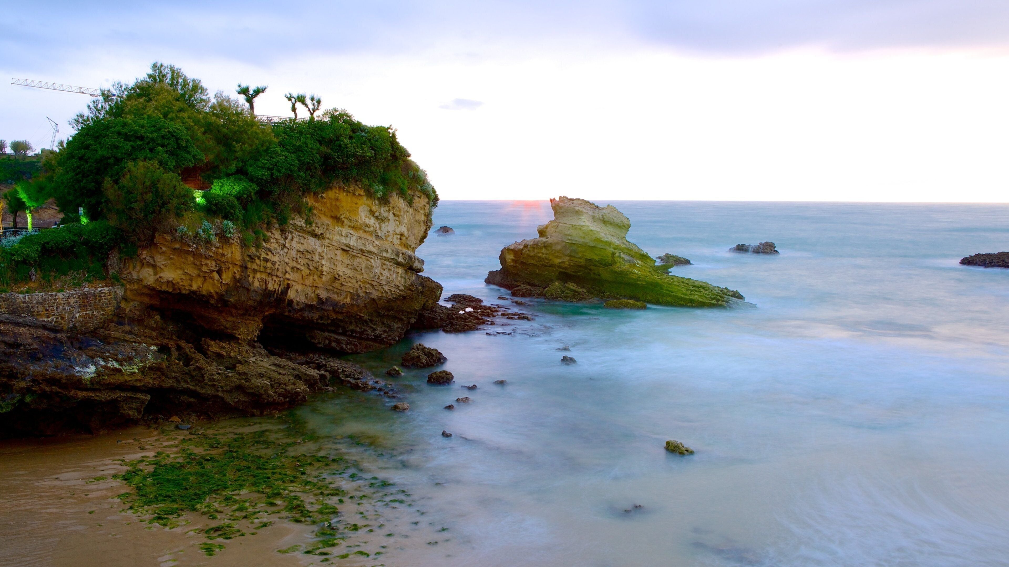 Biarritz City Centre featuring rugged coastline, general coastal views and a sunset