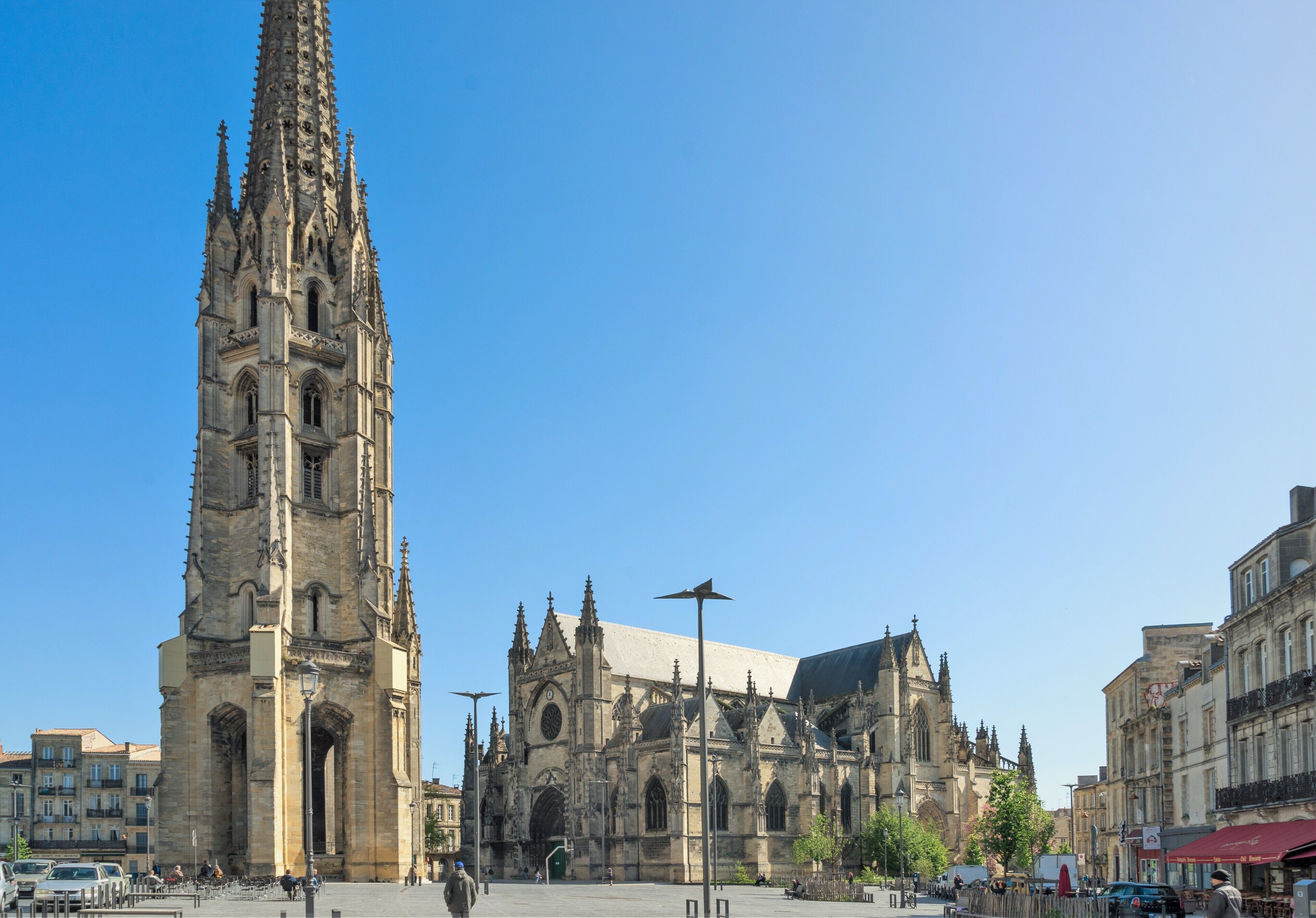 A historic cathedral with a tall spire and intricate architecture.