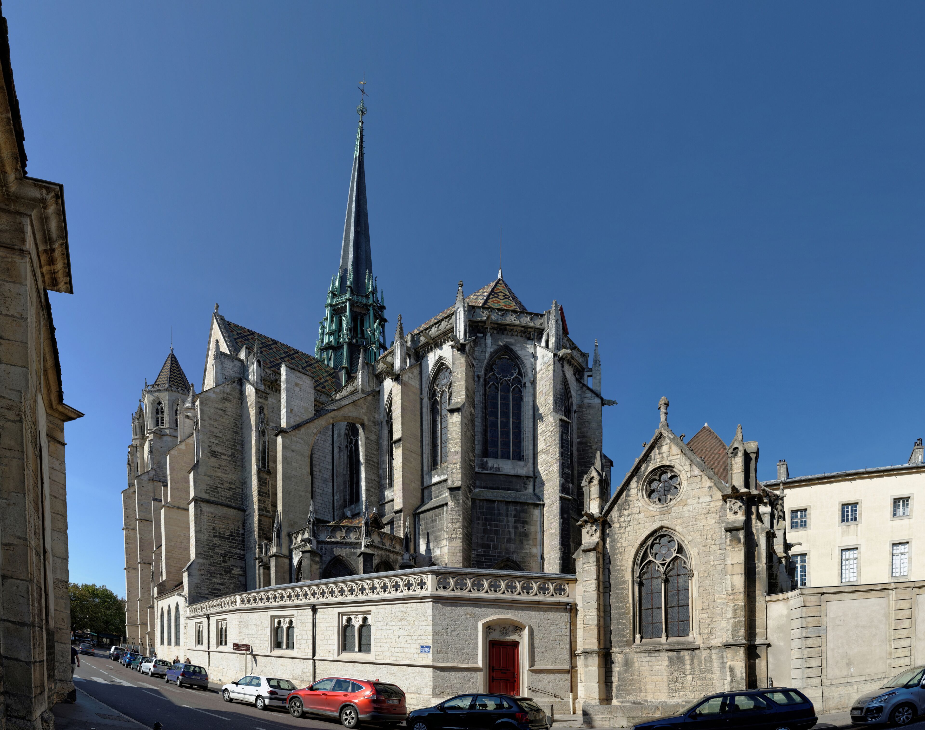 A historic church with a tall spire and intricate architecture.