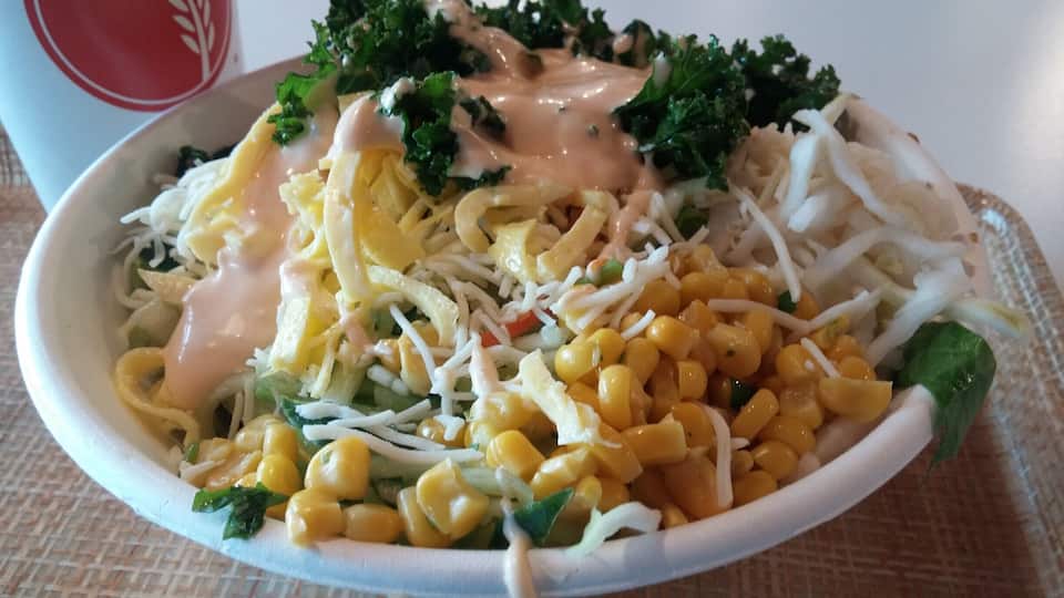 Bibibop Asian Grill is the Asian equivalent of the Chipotle style of dining.
A bowl filled with wild purple rice, bean sprouts, sauteed potatoes, chicken, cucumber, lettuce, carrot, daikon, cheese, corn and egg topped with yum yum sauce.