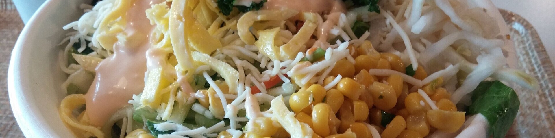 Bibibop Asian Grill is the Asian equivalent of the Chipotle style of dining.
A bowl filled with wild purple rice, bean sprouts, sauteed potatoes, chicken, cucumber, lettuce, carrot, daikon, cheese, corn and egg topped with yum yum sauce.