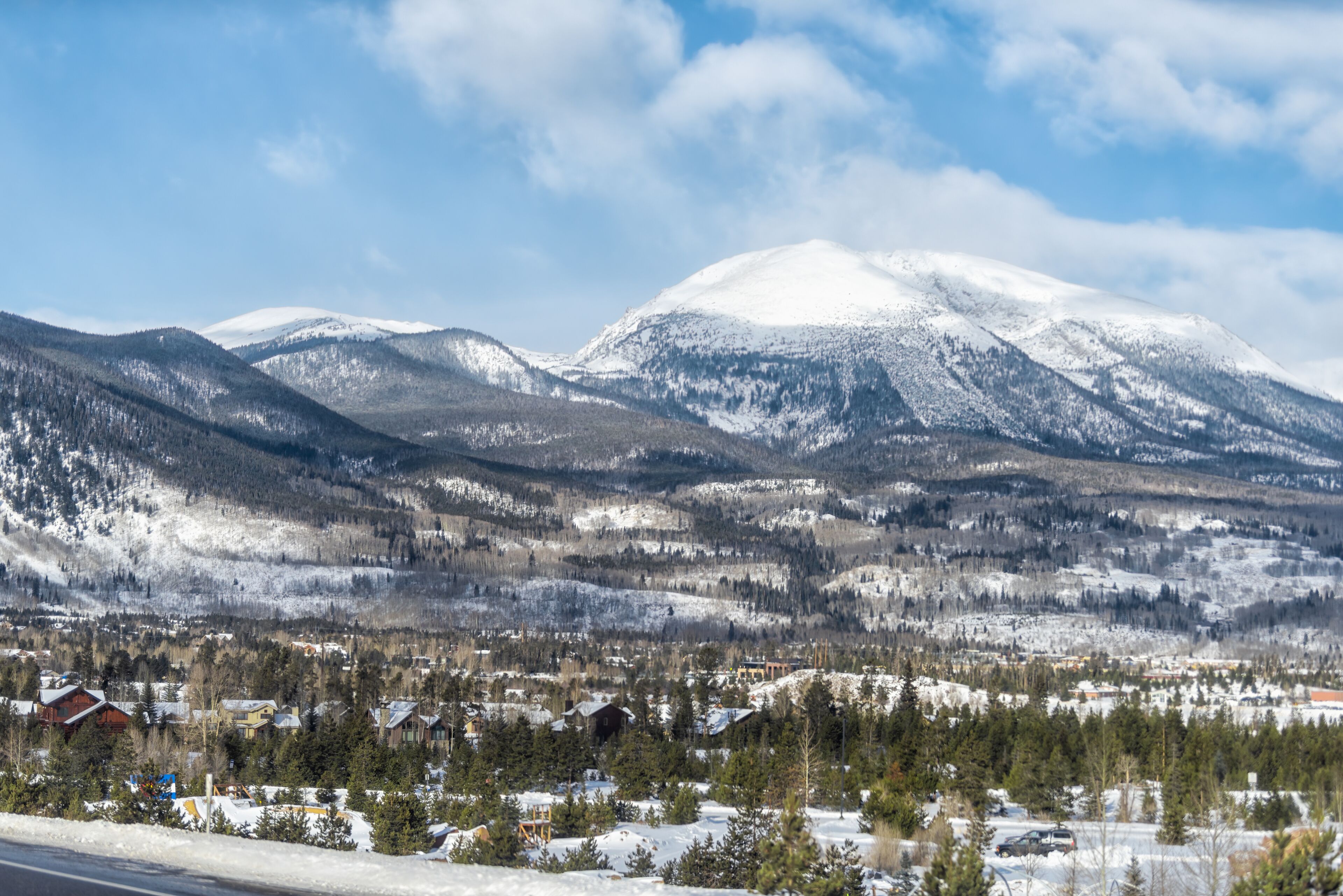Frisco, Colorado snow capped rocky mountain Buffalo peak and houses buildings in winter weather blue sky and view of Silverthorne
