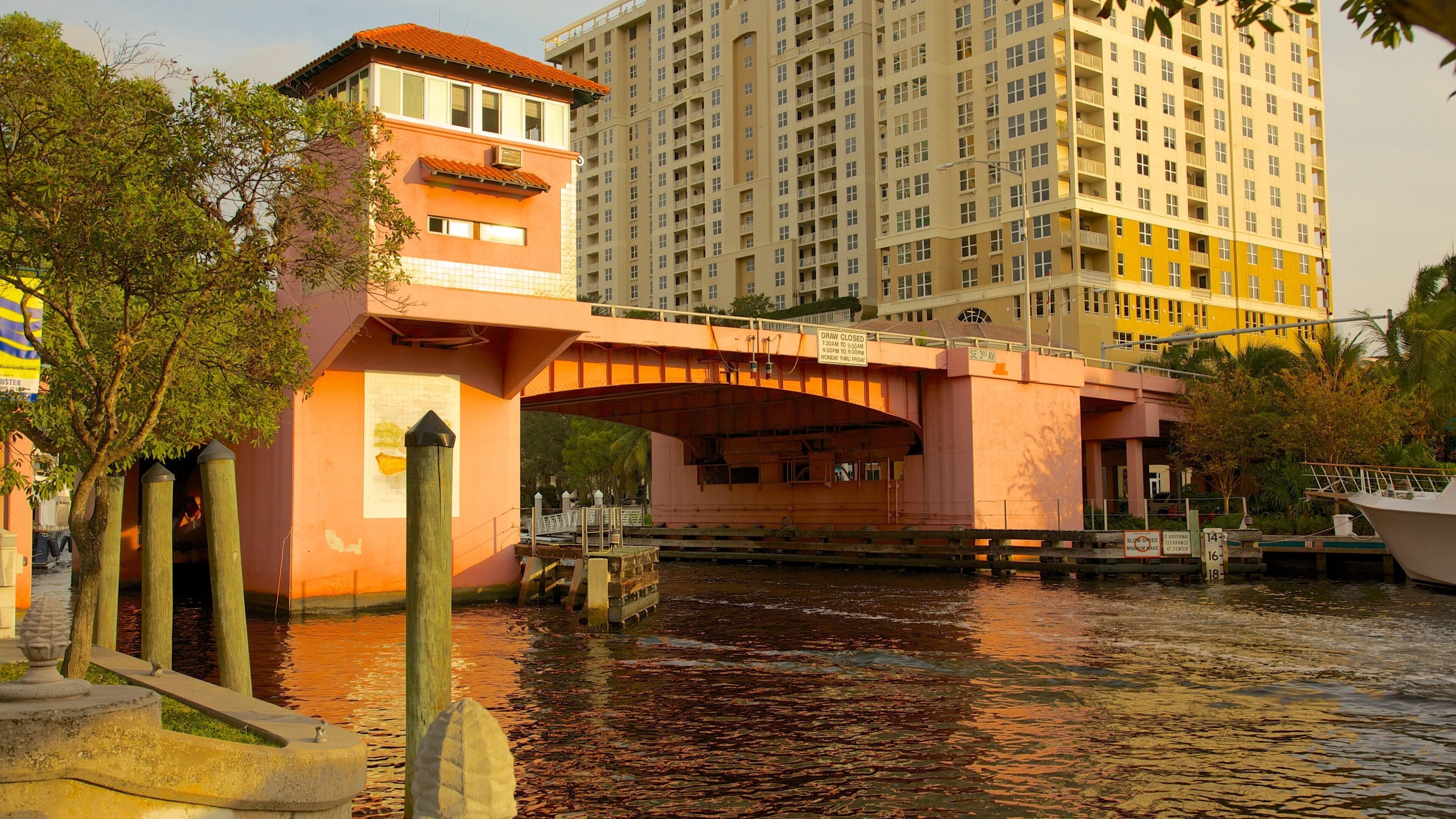 Riverwalk featuring a river or creek and a city
