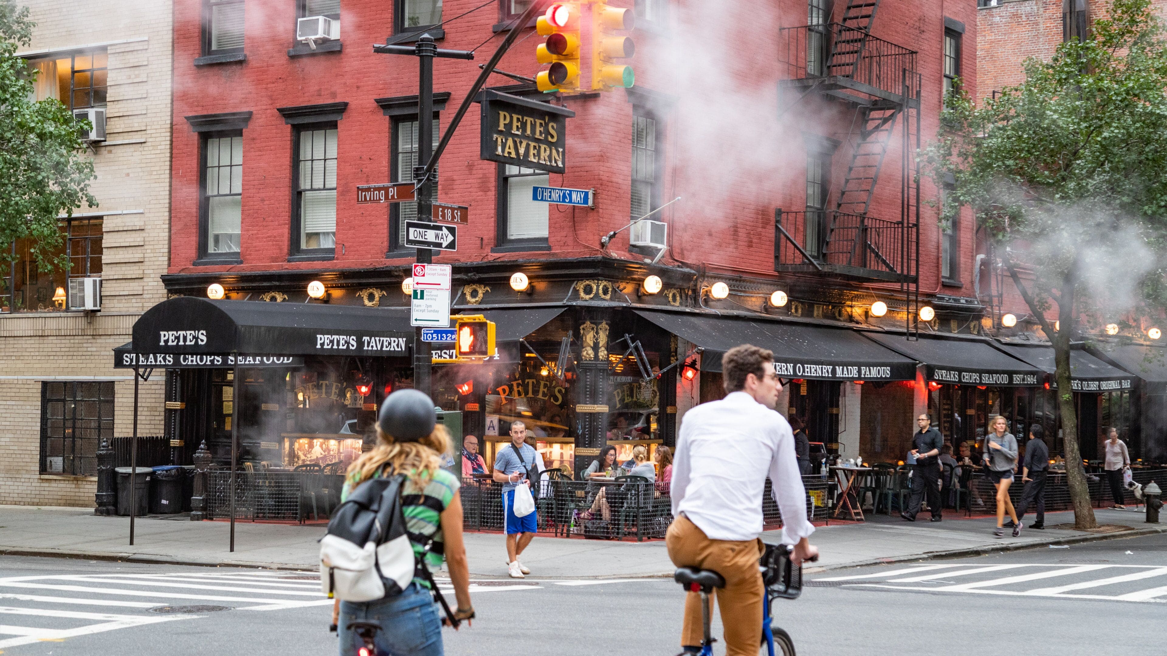 Gramercy which includes a city, road cycling and street scenes