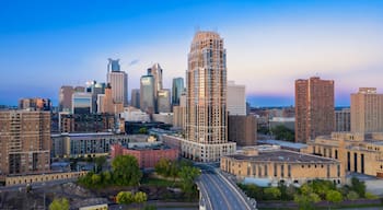 Minneapolis skyline at dawn, showcasing modern and historic architecture. Urban development and revitalization. Downtown West, Minneapolis, Minnesota, United States