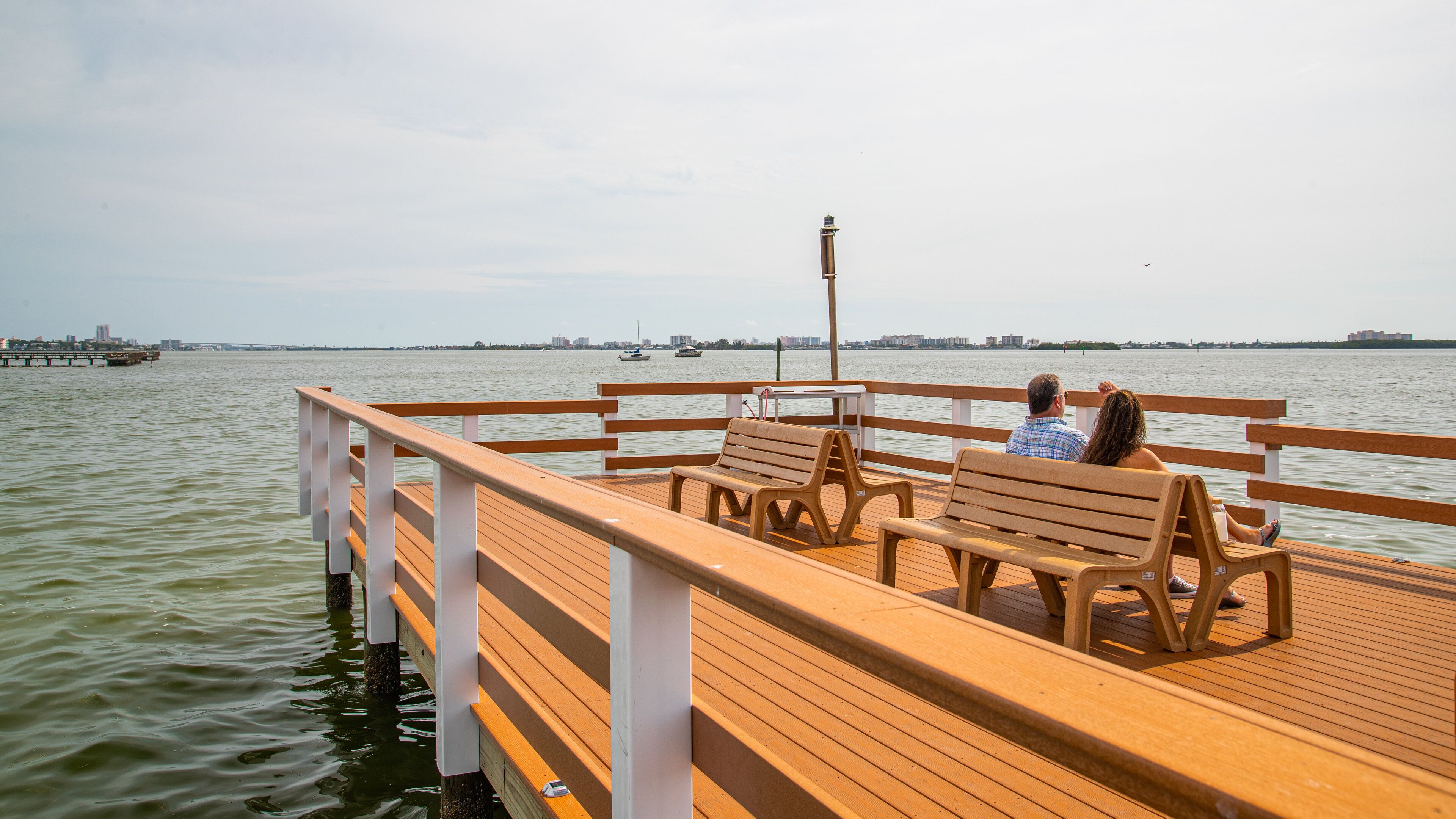 Downtown Dunedin featuring a lake or waterhole as well as a couple