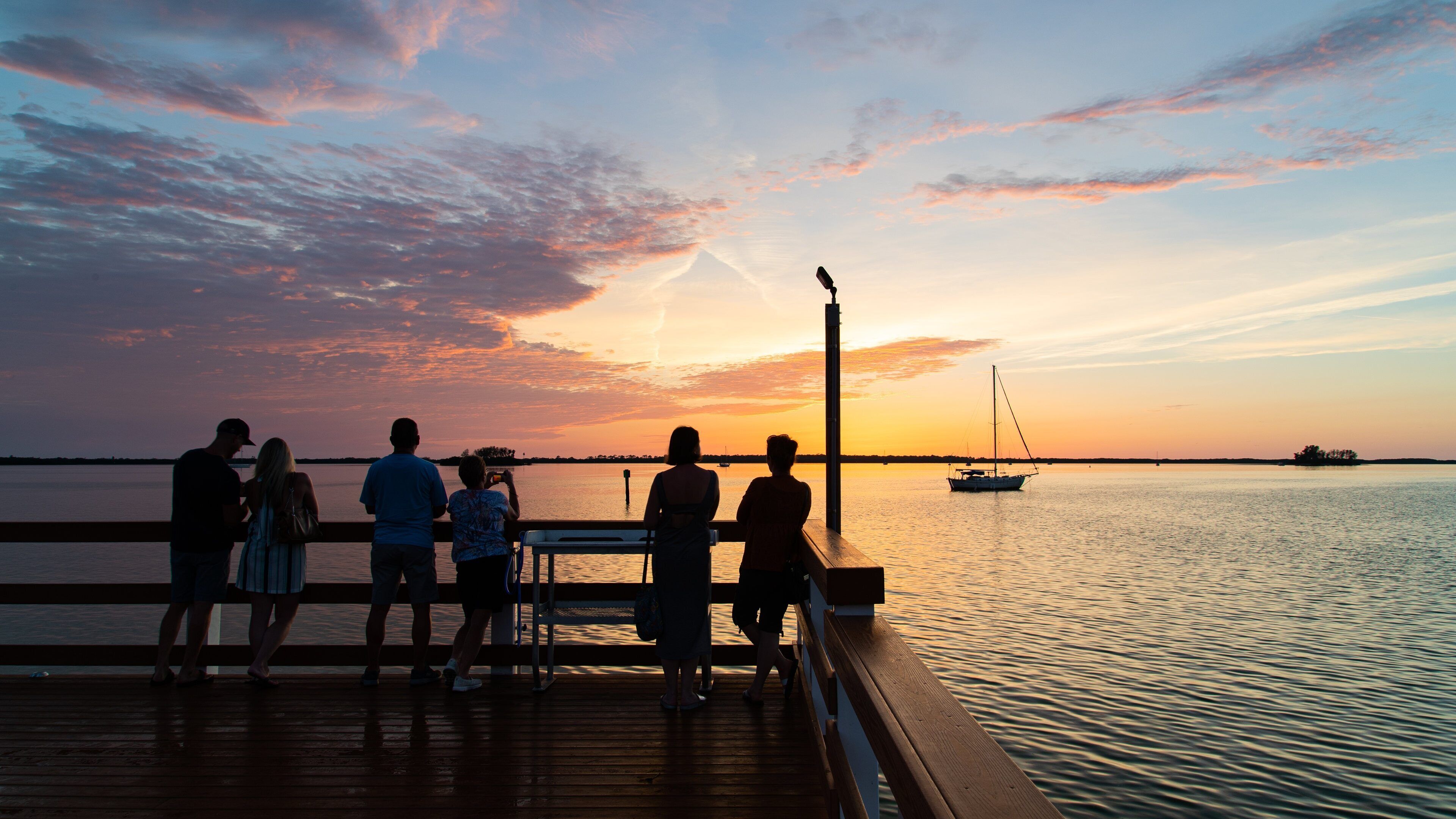 Downtown Dunedin featuring a sunset, views and general coastal views