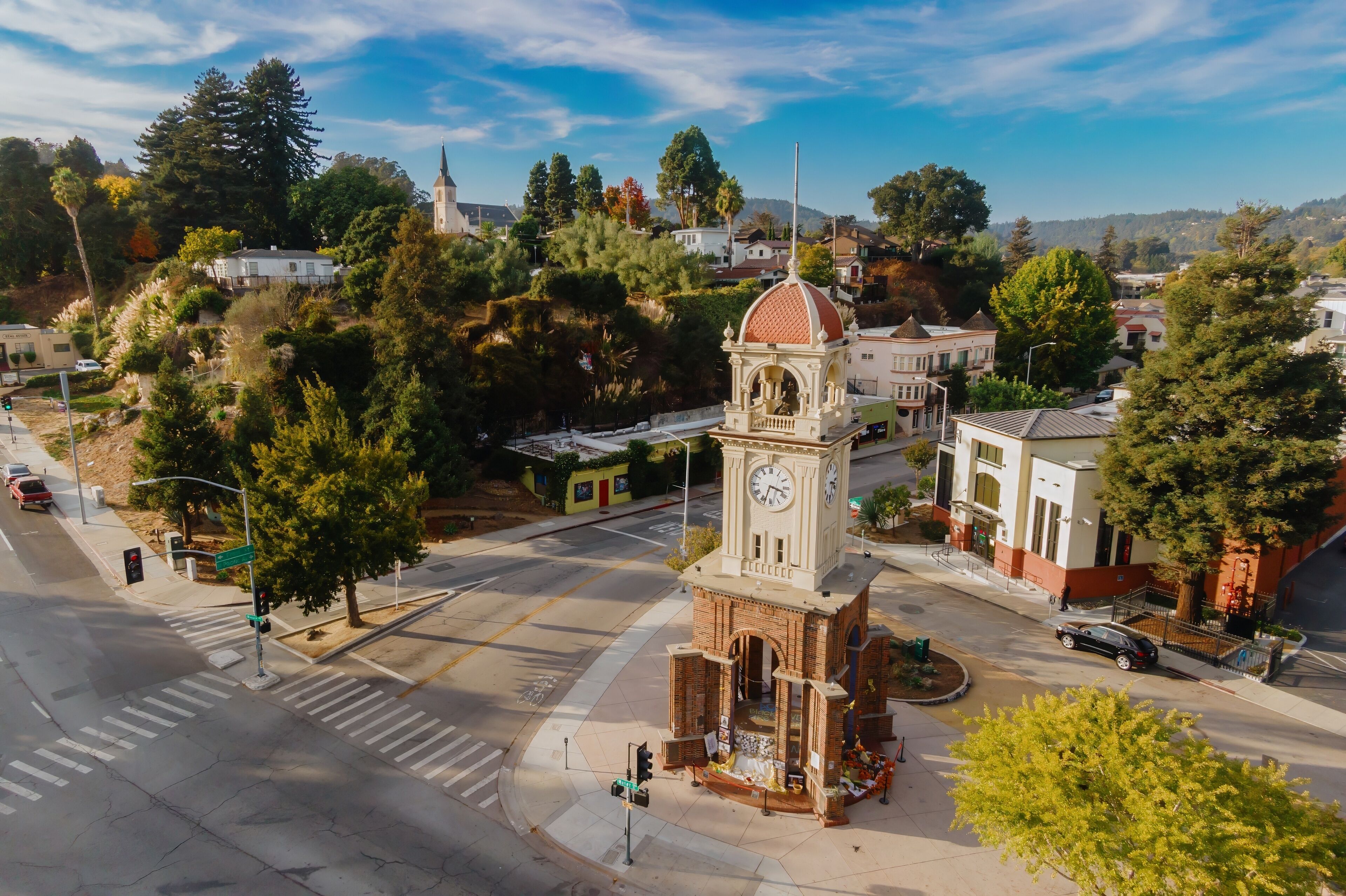 Clock tower in downtown Santa Cruz, California, USA. The tower is a local landmark and gathering place, decorated with flowers and pumpkins.