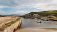 Ballintoy Harbour showing general coastal views, boating and a bay or harbor